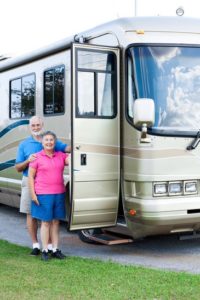 Happy retired couple that got their RV/Motor Home towed